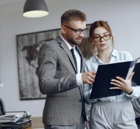 Woman with glasses.Businessman with documents.Colleagues work together