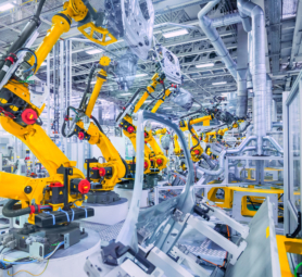 robotic arms in a car plant