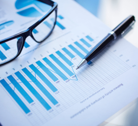 Image of eyeglasses, pen and financial document