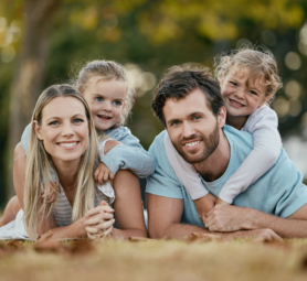 Family, park and portrait of parents with kids enjoy summer holiday, weekend and quality time outdoors. Love, picnic and happy mom, father and children smiling, bonding and relax together in nature.